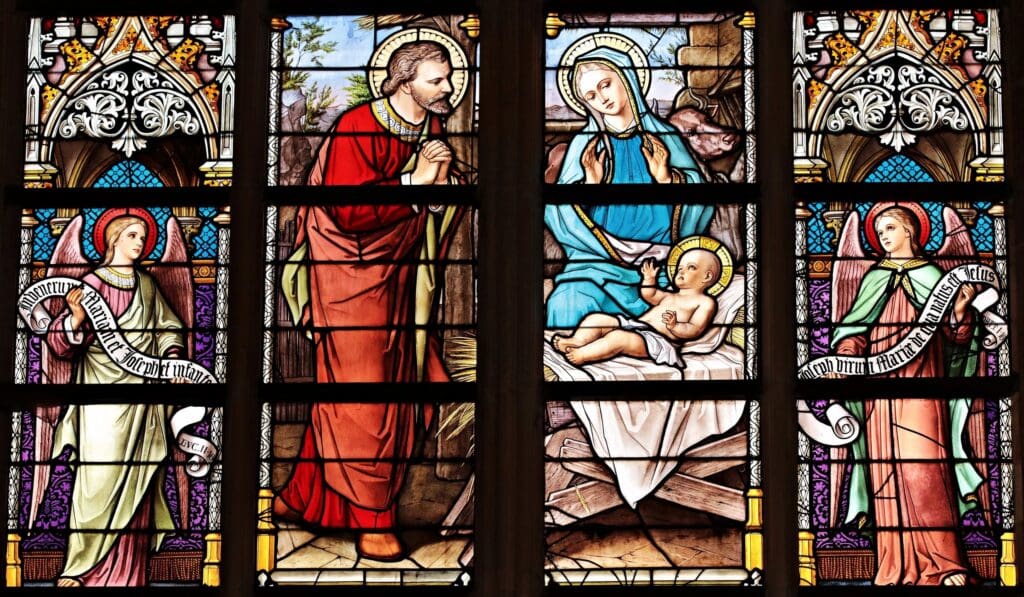 A stained glass window of jesus and mary