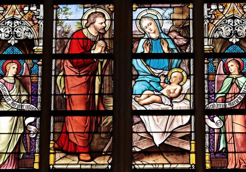 A stained glass window of jesus and mary